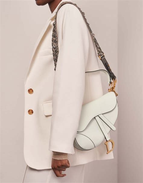 dior saddle bag with thick strap|Dior saddle bag on model.